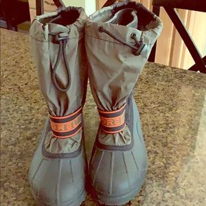 Army green, black, and orange waterproof boots